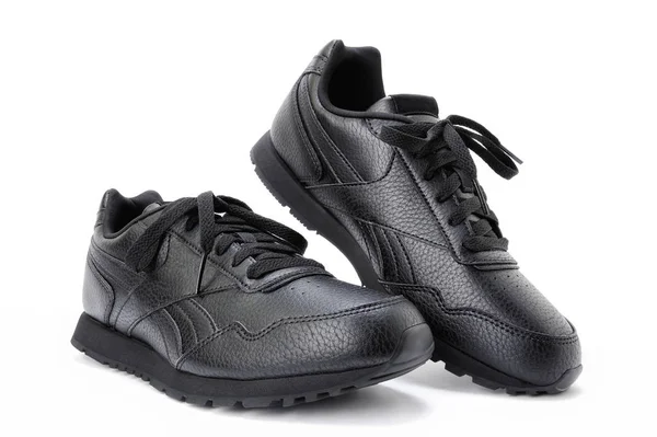 Női sport cipő, fehér alapon fekete. — Stock Fotó