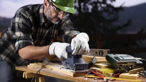 Adult Carpenter Craftsman Wearing Helmet Leather Protective Gloves Electric Sander — Αρχείο Βίντεο