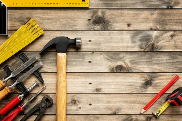 Work tools for carpenter on wooden background. Carpentry. — Stock Photo, Image