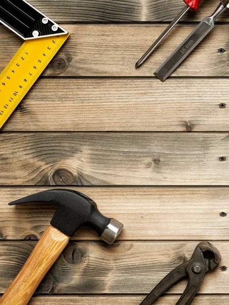 Work tools for carpenter on wooden background. Carpentry. Stock Photo