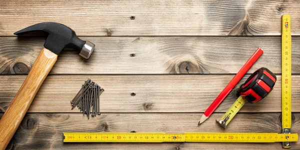 Work tools for carpenter on wooden background. Carpentry. — Stock Photo, Image