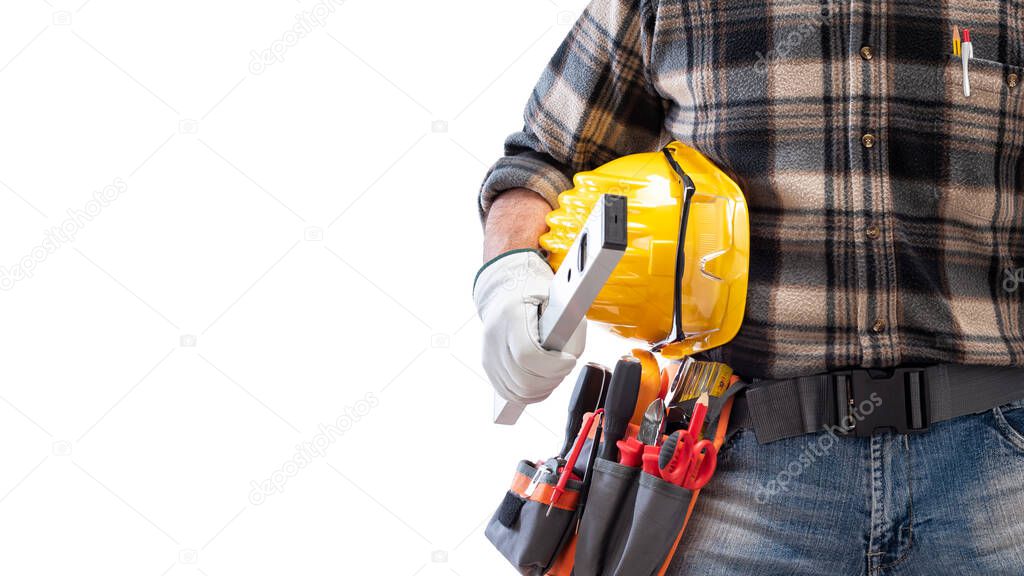 Electrician holds the level in his hand, helmet with protective goggles. Construction industry, electrical system. Isolated on a white background.