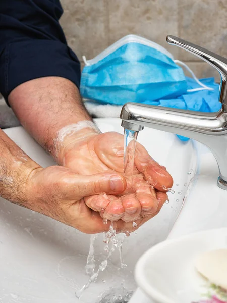 Coronavirus prevention. Hand washing with soapy and hot water, the use of the mask and gloves stops the infection from Covid-19. Personal hygiene. Health.