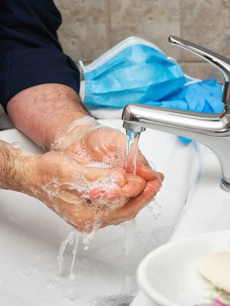 Coronavirus prevention. Hand washing with soapy and hot water, the use of the mask and gloves stops the infection from Covid-19. Personal hygiene. Health.