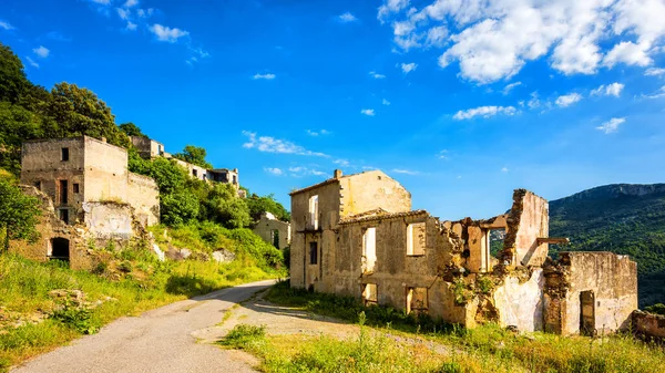 Ruined houses in the ghost village of Old Gairo, destroyed by the 1951 flood. Sardinia, Italy.