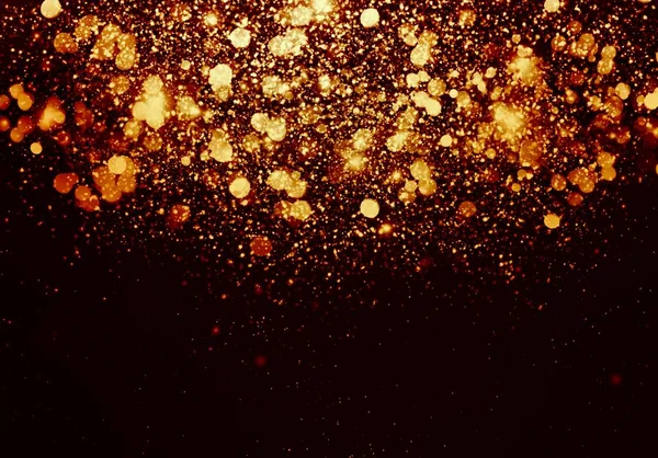 falling sparkling glitters on black background