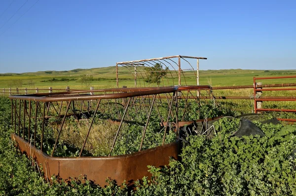 Old cattle feeder in a corral — Stock Photo, Image