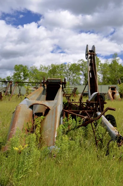 Old rusty one row corn picker — Stock Photo, Image