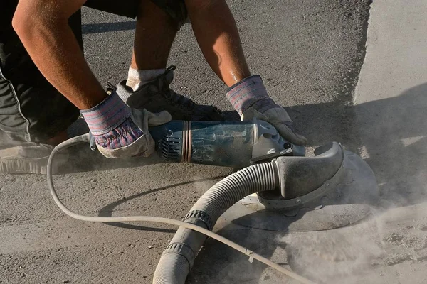 Grinding rough concrete on a road and curb project — Stock Photo, Image