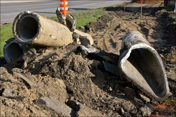 Street and road repair with old culverts being removed