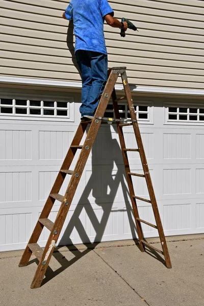 Man working on a step ladder