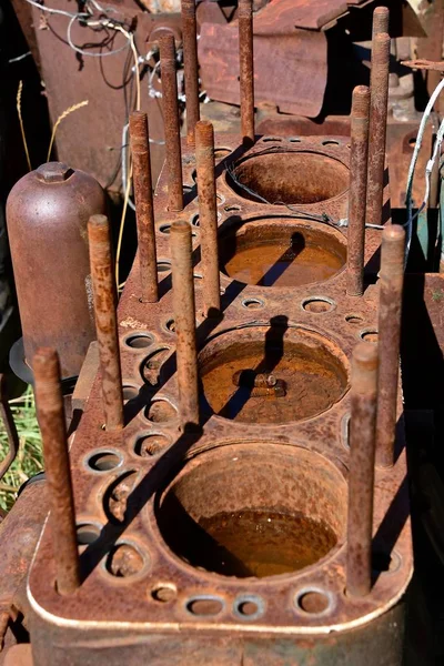 Rusty cylinder block of an old tractor motor