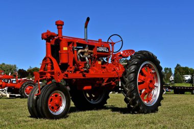 DALTON, MINNESOTA, Sept 8, 2017: A restored  F-20 old Farmall tractor is displayed at the annual September Dalton, MN tractor  and farm show where 1000s attend the second full weekend. clipart