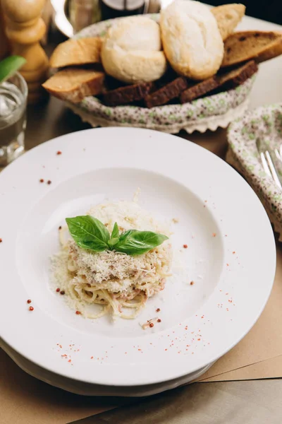 Italian pasta with parmesan and basil — Stock Photo, Image