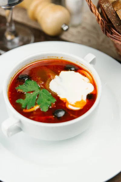 Tomato soup with olives and sour cream — Stock Photo, Image