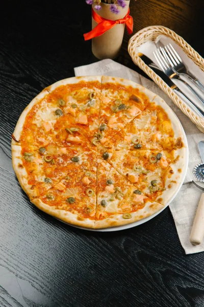 Cheese pizza with olives and salmon — Stock Photo, Image