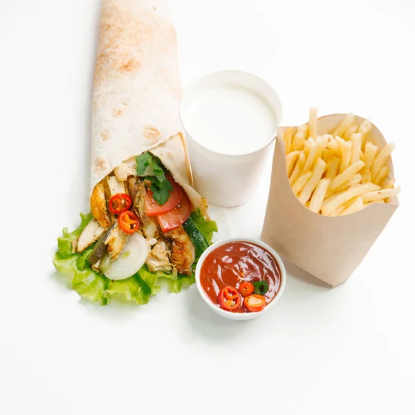 Chicken and vegetables burrito with french fries