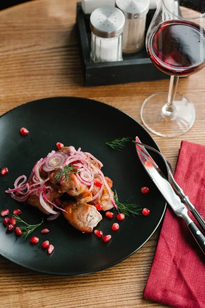 Roasted lobster meat with onions and pomegranate