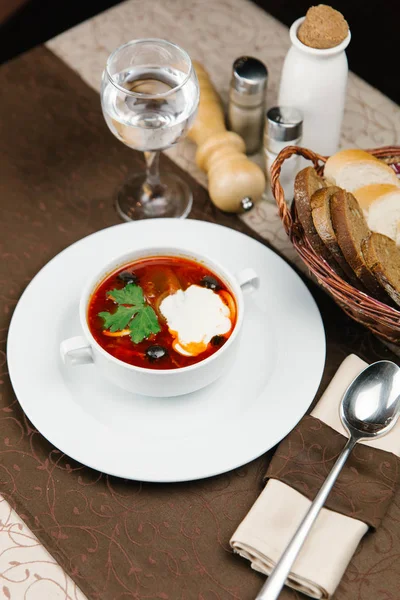 Meat soup with olives and sour cream — Stock Photo, Image