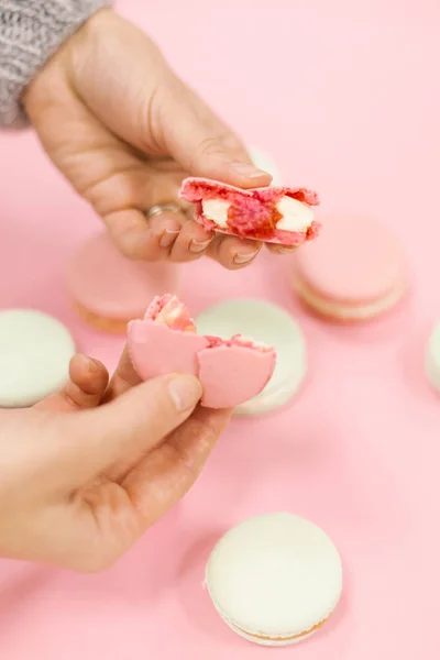 Close View Cracked Macaron Female Hands Pink Background — Stock Photo, Image