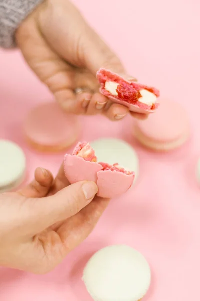 Close View Cracked Macaron Female Hands Pink Background — Stock Photo, Image