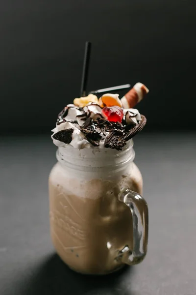 Sweet coffee cocktail served with different toppings