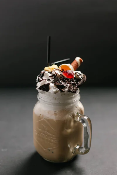Sweet coffee cocktail served with different toppings