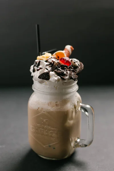 Sweet coffee cocktail served with different toppings