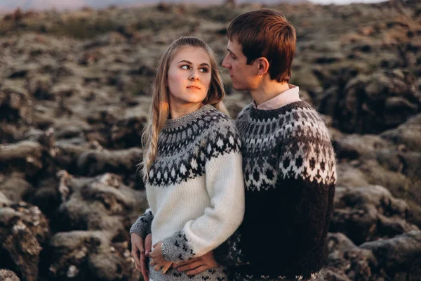 Young couple cuddling and looking eyes to eyes