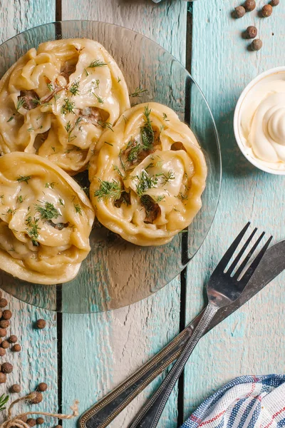 Closeup Manti Served Glass Dish Blue Wooden Table Knife Fork — Stock Photo, Image