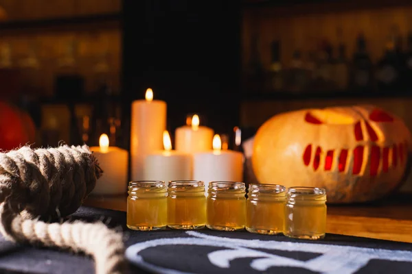 pumpkins and candles on the table, Halloween decor