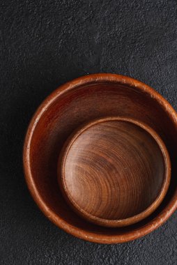 baked salmon steaks with fresh vegetable green salad on black table
