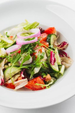 Vegetables vegetarian salad in white plate