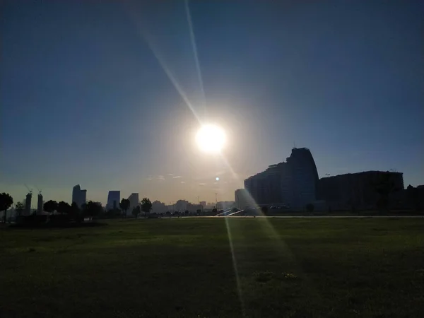 Sun shining. Sun and park view. Sun flare and lawn.