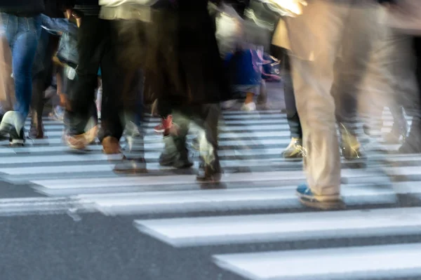 Blurred people in Shibuya crossroads, Japan