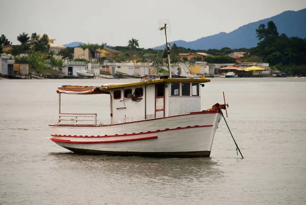 hing boats anchored in the river, floating peacefully in harbor