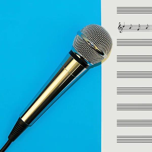 Microphone and sheet music lie on a blue background