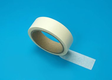 Round roll of white duct tape, adhesive tape