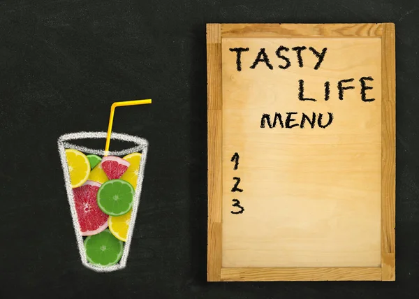 Fruit citrus slices in a glass and a wooden board