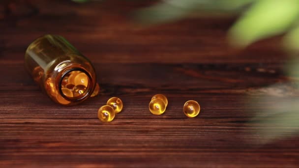 Vitamins Supplements Pills Omega Cod Liver Oil Medicines Wooden Table — Stockvideo