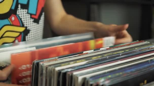 Young Woman Looking Old Vinyl Records Flea Market — Stock Video