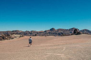 Man walking on the lonely lunar landscapes