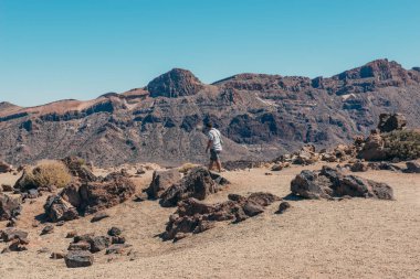 Man walking on the lonely lunar landscapes