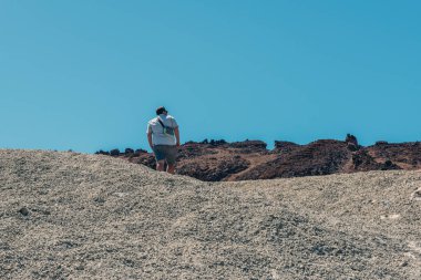 Man walking on the lonely lunar landscapes 