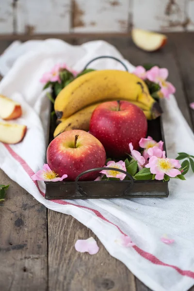 Fruit on a tray with pink flowers