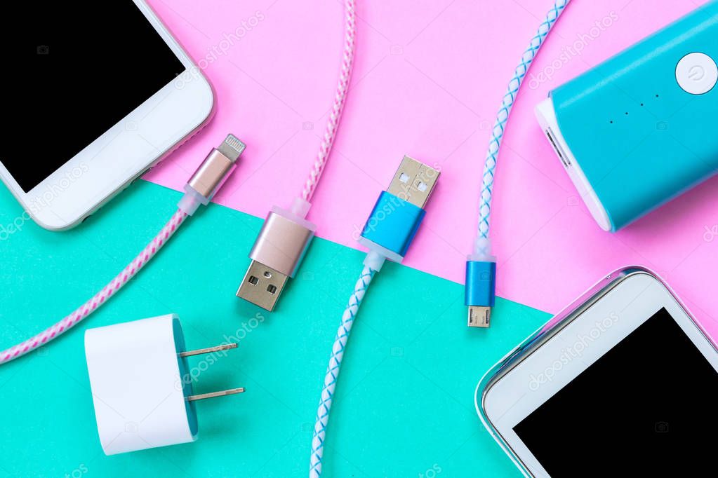USB charging cables for smartphone and tablet in top view — Stock Photo ©