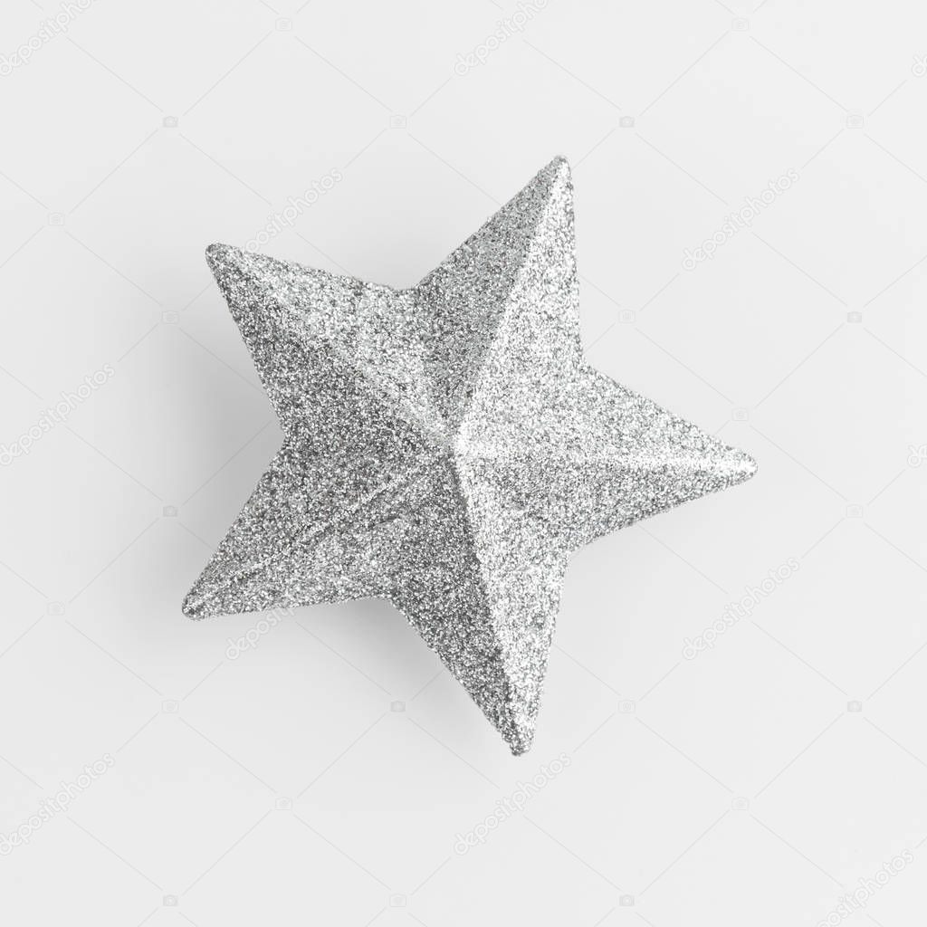 shining silver star in white