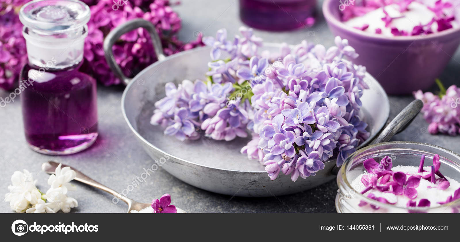 Lilac Flowers Sugar And Syrup Essential Oil With Flower Blossoms In Glass Jar Grey Stone Background Stock Photo C Anna Pustynnikova 144055881