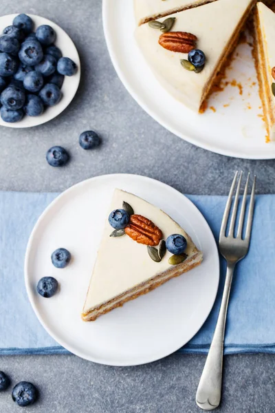 Vegan, raw carrot cake. Healthy food. Grey stone background Top view Copy space