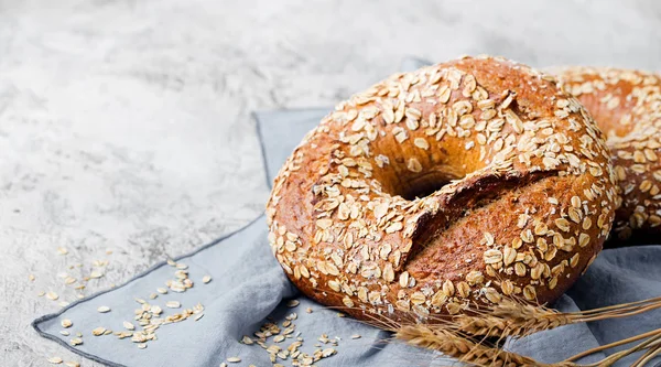 Bread with seeds on stone background. Copy space